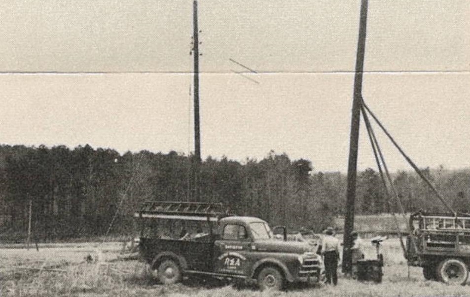 A black and white photo of an old truck